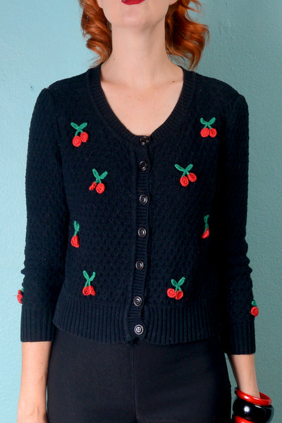 Vintage 1950s inspired waffle weave black cardigan with 3D red cherries